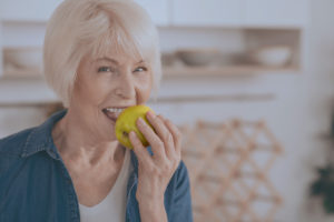 patient happy she got her Dental Implants by experienced doctors